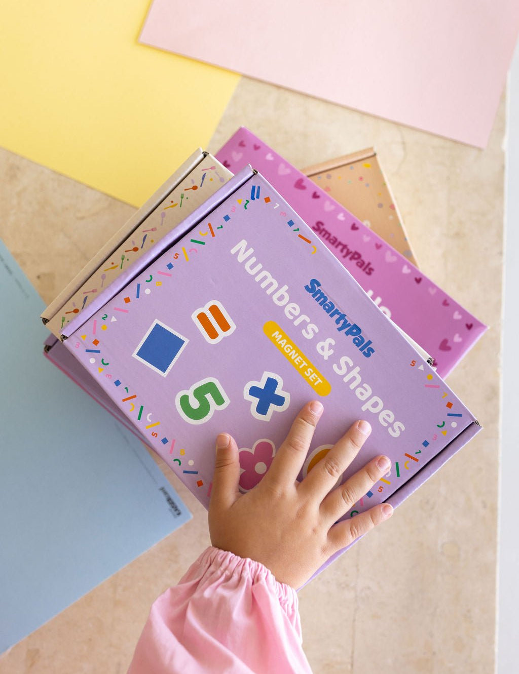 Children playing happily with screen-free SmartyPals toys during the winter school holidays