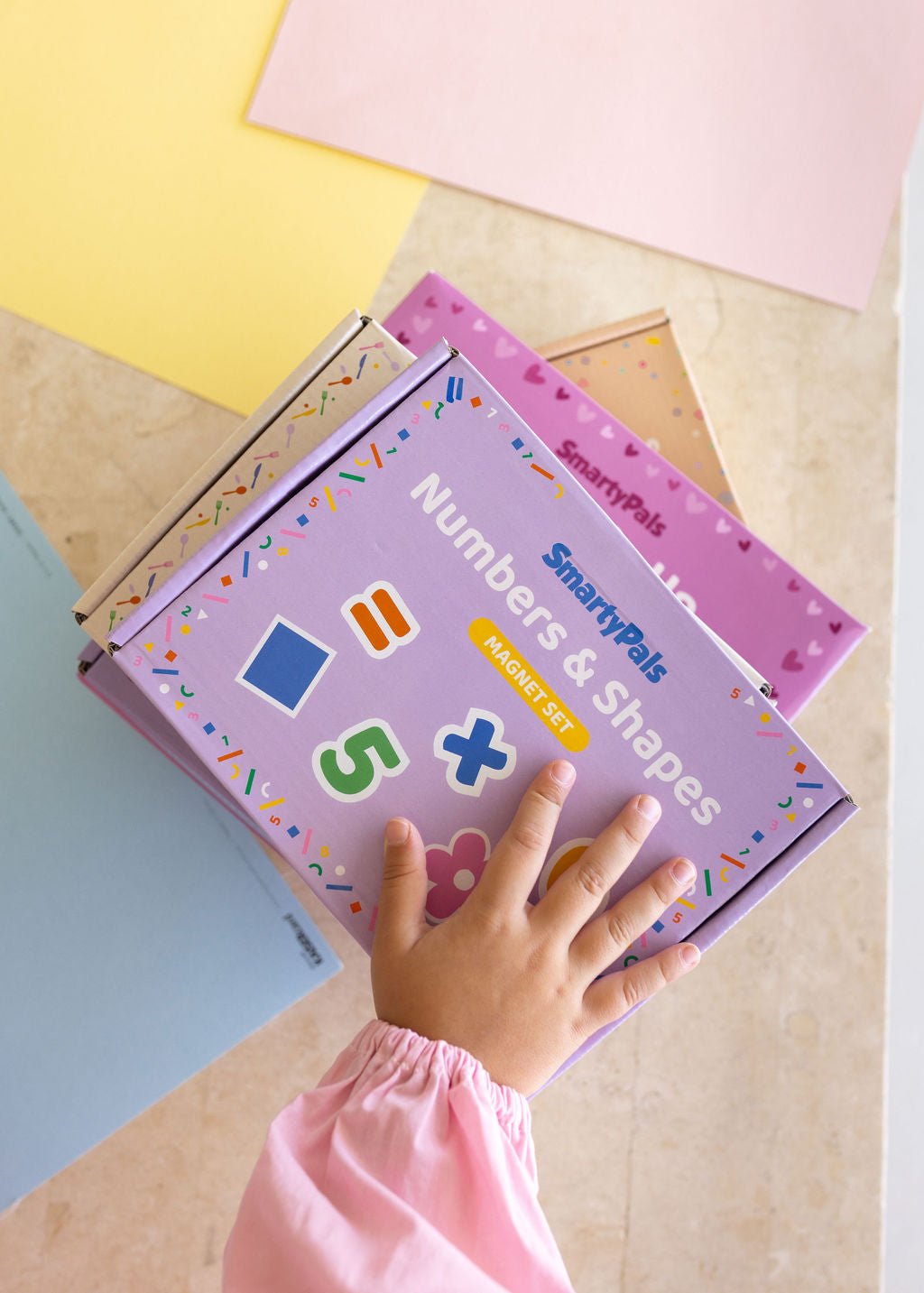 Children playing happily with screen-free SmartyPals toys during the winter school holidays