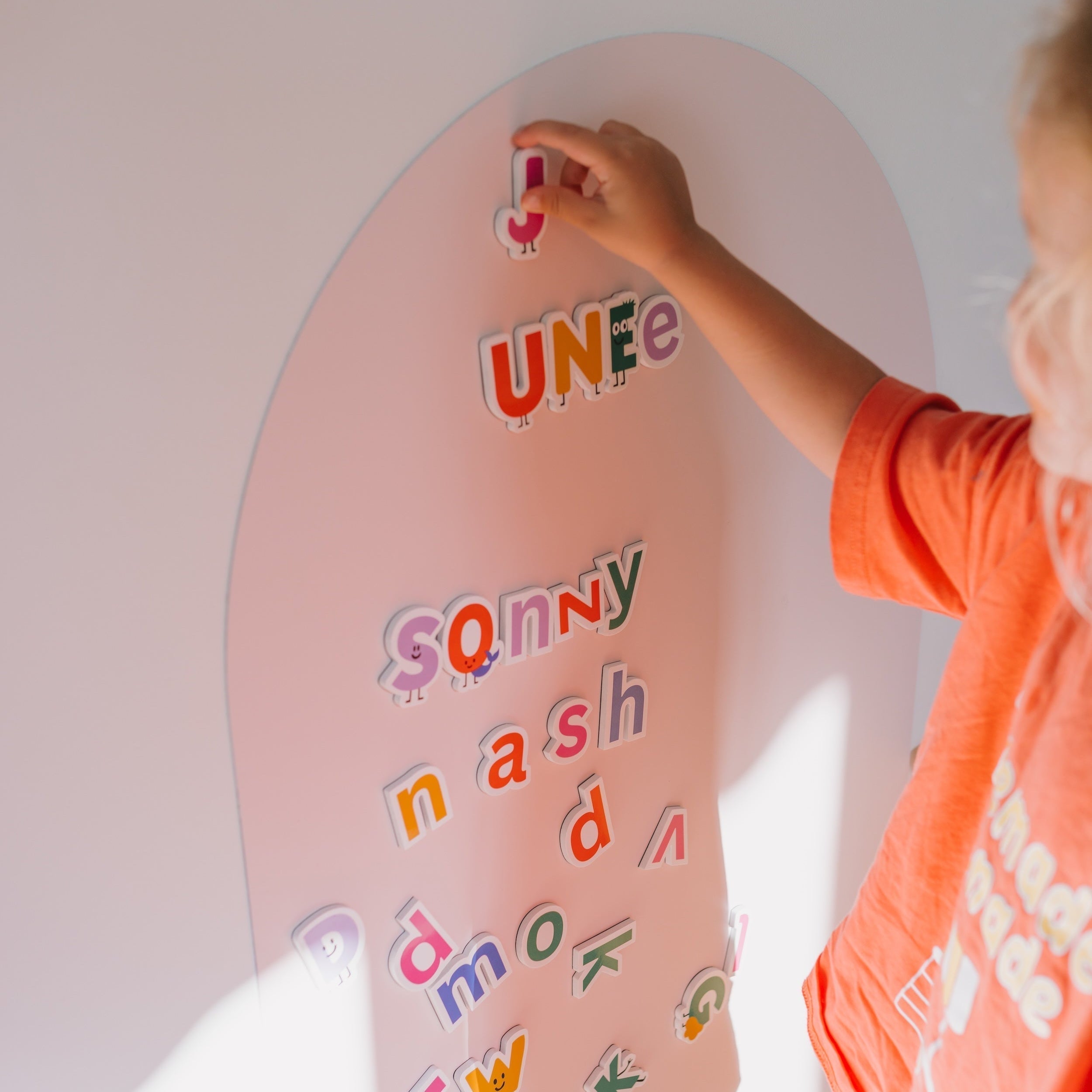Child playing with the SmartyPals Alphabet Magnet Set, learning letters through screen-free play